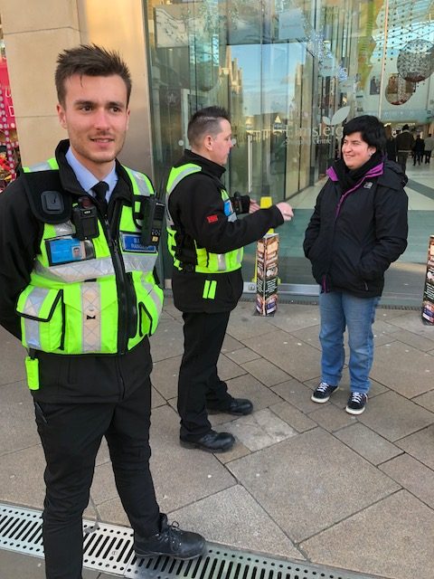 Risk Secured BID rangers engaging with a shopper in a town centre